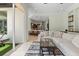 Bright living room with large sliding doors opening to a patio and open access to the kitchen at 6959 Westchester Cir, Bradenton, FL 34202