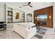 Inviting living room with fireplace, wood accent wall, and comfortable seating at 6959 Westchester Cir, Bradenton, FL 34202