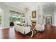 Inviting living room showcasing a fireplace, chandelier, and seamless indoor-outdoor flow to the screened pool at 6959 Westchester Cir, Bradenton, FL 34202
