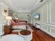 Spacious main bedroom with hardwood floors, TV, and elegant decor at 6959 Westchester Cir, Bradenton, FL 34202