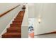 Beautiful staircase with hardwood steps and banister leading to the upper level at 6959 Westchester Cir, Bradenton, FL 34202