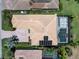 Aerial view of the home showing the roof, brick driveway, and screened-in pool with lanai at 7037 Brier Creek Ct, Lakewood Ranch, FL 34202