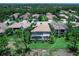 Aerial view of the home with a screened-in pool area surrounded by well-maintained landscaping in a lush community at 7037 Brier Creek Ct, Lakewood Ranch, FL 34202
