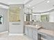 Bathroom vanity with lots of counter space and a decorative backsplash at 7037 Brier Creek Ct, Lakewood Ranch, FL 34202