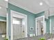 Bright bathroom with mirrored wall, tile accents, with adjacent shower, offering a spa-like experience at 7037 Brier Creek Ct, Lakewood Ranch, FL 34202