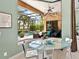 Breakfast nook with glass table and chairs offers a view of the outdoor pool area at 7037 Brier Creek Ct, Lakewood Ranch, FL 34202