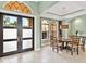 Dining room with archways, and windows with a view of the front exterior at 7037 Brier Creek Ct, Lakewood Ranch, FL 34202