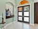 Foyer with double doors featuring glass panels, and neutral paint at 7037 Brier Creek Ct, Lakewood Ranch, FL 34202