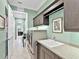 Spacious laundry room with modern appliances, countertop, and built in utility sink at 7037 Brier Creek Ct, Lakewood Ranch, FL 34202