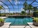 This backyard paradise features a screened-in pool, spa, and landscaping for privacy at 7037 Brier Creek Ct, Lakewood Ranch, FL 34202