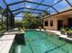 A screened-in pool area is the highlight of this home, surrounded by mature landscaping at 7037 Brier Creek Ct, Lakewood Ranch, FL 34202