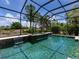 The inviting screened-in pool area features a spa and waterfall for relaxation and entertainment at 7037 Brier Creek Ct, Lakewood Ranch, FL 34202
