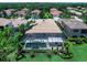 A luxurious pool with screen enclosure and meticulously landscaped backyard at 7037 Brier Creek Ct, Lakewood Ranch, FL 34202