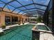 This stunning home features an inviting screened-in pool and spa, ideal for relaxation and entertaining at 7037 Brier Creek Ct, Lakewood Ranch, FL 34202