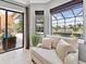 A sitting area has a view of the pool and outdoor space at 7037 Brier Creek Ct, Lakewood Ranch, FL 34202
