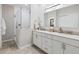 Beautiful bathroom featuring double sink vanity, walk-in shower and sleek fixtures at 7387 Divot Loop # 15-D, Lakewood Ranch, FL 34202