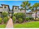 Charming two-story condo unit with lush landscaping and a well-manicured lawn at 7387 Divot Loop # 15-D, Lakewood Ranch, FL 34202