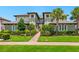 Beautiful condo building featuring manicured landscaping, lush green lawns, and inviting curb appeal at 7387 Divot Loop # 15-D, Lakewood Ranch, FL 34202