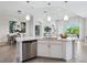 Spacious open concept kitchen with island and stainless steel dishwasher at 7387 Divot Loop # 15-D, Lakewood Ranch, FL 34202