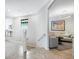 Bright living room featuring neutral tones, modern lighting, and staircase leading downstairs at 7387 Divot Loop # 15-D, Lakewood Ranch, FL 34202