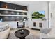 Comfortable office featuring built-in desk, shelving and nearby window views at 7387 Divot Loop # 15-D, Lakewood Ranch, FL 34202