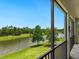 Enjoy stunning pond view from a screened lanai at 7387 Divot Loop # 15-D, Lakewood Ranch, FL 34202