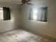 A cozy bedroom with tiled floors and natural light at 7555 15Th N St, St Petersburg, FL 33702