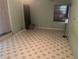Bedroom with tile flooring and a floor lamp at 7555 15Th N St, St Petersburg, FL 33702