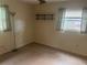 Bedroom with natural light, wood-look flooring, and simple shelving unit at 7555 15Th N St, St Petersburg, FL 33702