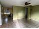 Open floor plan with ceiling fan and tile flooring at 7555 15Th N St, St Petersburg, FL 33702