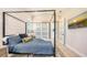 Cozy bedroom featuring a four poster bed, with ample closet space, and a serene atmosphere at 8006 20Th W Pl, Bradenton, FL 34209