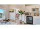 Comfortable living area with a kitchenette, seamlessly flowing into a view of the bedroom at 8006 20Th W Pl, Bradenton, FL 34209