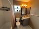 Cozy bathroom featuring a shower-tub combo, vanity, and a tiled floor at 853 Albritton Ave, Sarasota, FL 34232