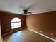 Bright bedroom with wood-look laminate flooring, neutral paint, and a sunny window at 853 Albritton Ave, Sarasota, FL 34232