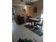 Elegant dining room featuring tile floors, a modern chandelier, and a stylish buffet at 853 Albritton Ave, Sarasota, FL 34232