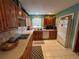 Charming kitchen featuring tile backsplash, stainless steel appliances, and ample counter space at 853 Albritton Ave, Sarasota, FL 34232