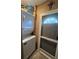 This laundry area includes a stacked washer and dryer, and a door at 853 Albritton Ave, Sarasota, FL 34232