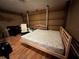 This room features a bed, wood-look floors, and interior walls at 853 Albritton Ave, Sarasota, FL 34232
