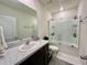 Clean bathroom with a granite countertop vanity and sleek glass enclosed shower at 8995 Milestone Dr, Sarasota, FL 34238