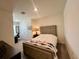 Comfortable bedroom featuring neutral walls and an adjacent desk area for a convenient workspace at 8995 Milestone Dr, Sarasota, FL 34238