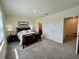 Spacious bedroom with carpeted floors, white walls, and ample natural light at 8995 Milestone Dr, Sarasota, FL 34238