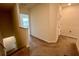 Upstairs hallway with carpeted floor, leading to bedrooms, bathroom, and other living areas at 8995 Milestone Dr, Sarasota, FL 34238
