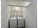 Convenient laundry room with new appliances, offering functionality and efficiency at 8995 Milestone Dr, Sarasota, FL 34238
