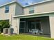 Covered outdoor patio featuring a seating area, perfect for entertaining and relaxing at 8995 Milestone Dr, Sarasota, FL 34238