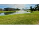 Community pond and green space featuring a fountain at 8995 Milestone Dr, Sarasota, FL 34238