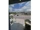 View from the window, community pool is visible beyond the screen at 8995 Milestone Dr, Sarasota, FL 34238