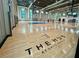 Indoor basketball court with shiny floors and ample lighting. 