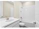 Clean bathroom featuring a tub with tile surround and a single sink vanity with a white countertop at 9292 Tequila Sunrise Dr, Sarasota, FL 34241