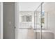 Elegant bathroom with dual sinks, a soaking tub, and a glass-enclosed shower at 9292 Tequila Sunrise Dr, Sarasota, FL 34241