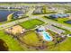 Community pool with playground and green space, offering residents a relaxing and Gathering-friendly area at 9292 Tequila Sunrise Dr, Sarasota, FL 34241